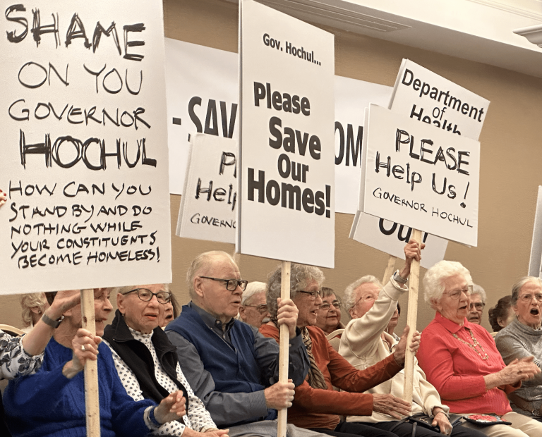 Harborside residents rally to stop threat of eviction after Health Dept. nixes sale